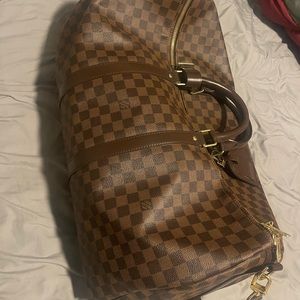 Louis Vuitton travel bag, had it only a year still like new! Still have the box.